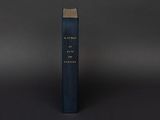 a blue book sitting on top of a black table