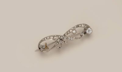 an image of a diamond and white gold broochle