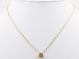 a gold necklace on a mannequin mannequin neck