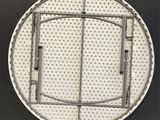 a round metal door with holes on it