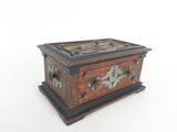 an old wooden box sitting on top of a white surface