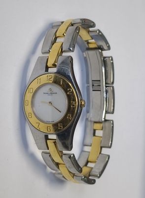 Montre de dame acier chromé et doré BAUME & MERCIER n°MV0451…