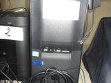 a computer and a printer sitting on top of each other
