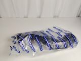 a bag of toothpaste sitting on a white surface