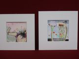 two framed pictures of jellyfishs on a red surface