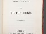 an open book with a picture of a man in a suit and tie