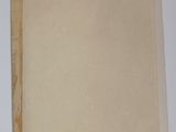 two pieces of paper sitting on a table next to each other