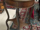 a table with a wooden top on a rug in a room