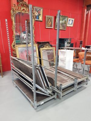 a lot of furniture in a room with a red wall