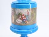 a blue vase with a painting on it sitting on a pedestal