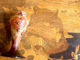 a piece of wood with a piece of food on top of it