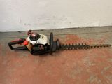 an image of a hedger that is on the ground