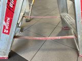 a ladder that is sitting on the floor in a building