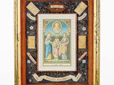 a framed picture of a painting of the virgin and child in an ornate frame