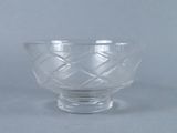 a glass bowl that is sitting on a table