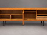 a wooden cabinet with open doors and shelves on legs