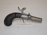 an old gun that is on display on a table