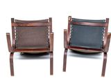 pair of mid - century danish leather lounge chairs