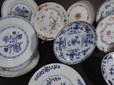 a lot of plates that are sitting on a table