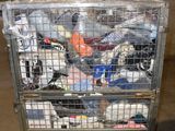 a metal cart with many items in it in a warehouse