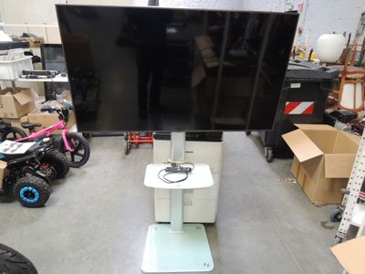 a television that is sitting on a stand in a room