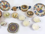 many different types of dishes and bowls on the table