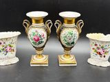 three vases are sitting next to each other on a table