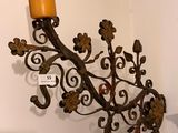 a candle that is hanging on the wall
