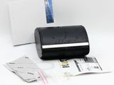 a black roll of paper with a credit card in it