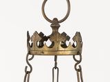 an image of a brass hanging light fixture with a crown on it
