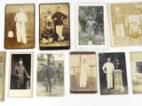 an old photo of a group of people standing next to each other