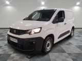 the white van is parked on a checkered floor in a room