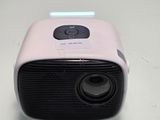 a small projector sitting on a white table