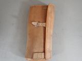 a tan leather case with a strap on it