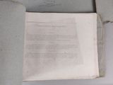 an open book sitting on top of a white table