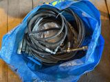 a blue bag with a bunch of hoses inside of it