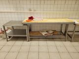 a table with a bunch of food on it in a kitchen