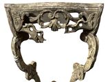 a metal shelf that has a heart shaped design on it