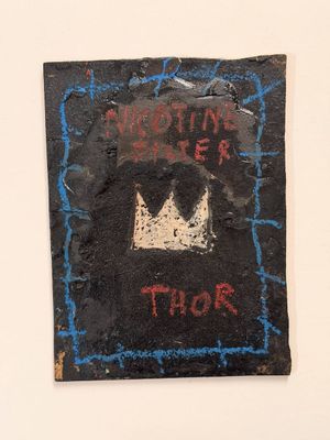 painting of a crown on a black piece of paper with writing on it