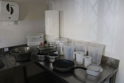 many pots and pans on the counter in the kitchen