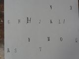 a piece of paper that has letters written on it