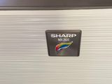 a white suitcase with a sticker on the side of it