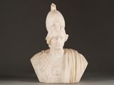 marble bust of a woman with a hat on top of her head