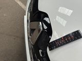 a measuring tape on the hood of a car