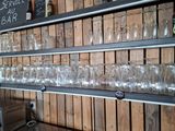 a shelf with wine glasses on it and a toaster on it