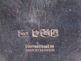 a silver plate with the words peace on it