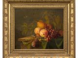 a painting of fruit in a gold frame on a table