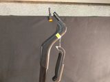 a black and silver vacuum cleaner on a black surface