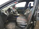 the interior of a car with the door open and the driver ' s seat up