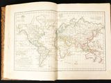 an open book with a map of the world on it